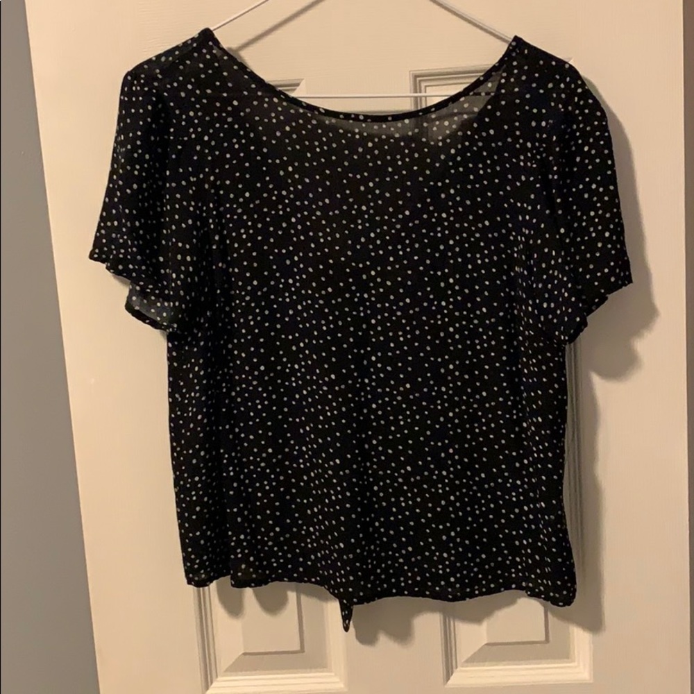 Black blouse with white polkadots
